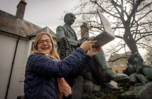 Lyndsey showing Dorset's most famous son Thomas Hardy how to use a laptop.