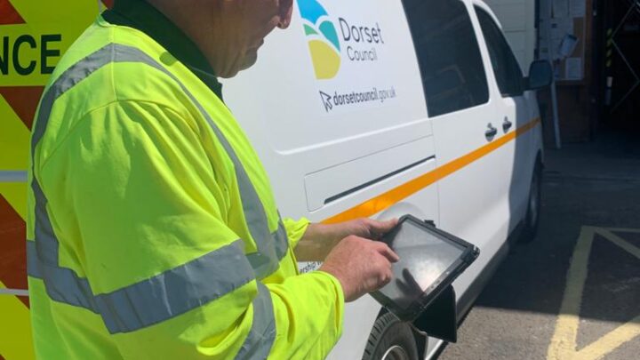Neil O Hara, Assistant Technician on his tablet