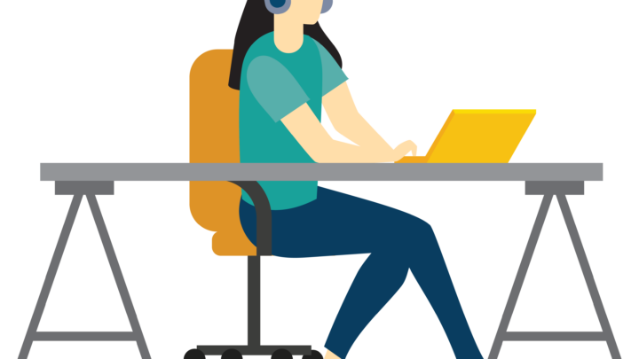 girl with laptop sitting at a desk