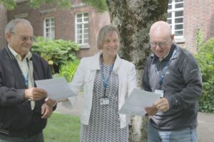 Two men receiving certificates