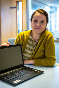 A woman pictured in Weymouth Job Centre with her new laptop