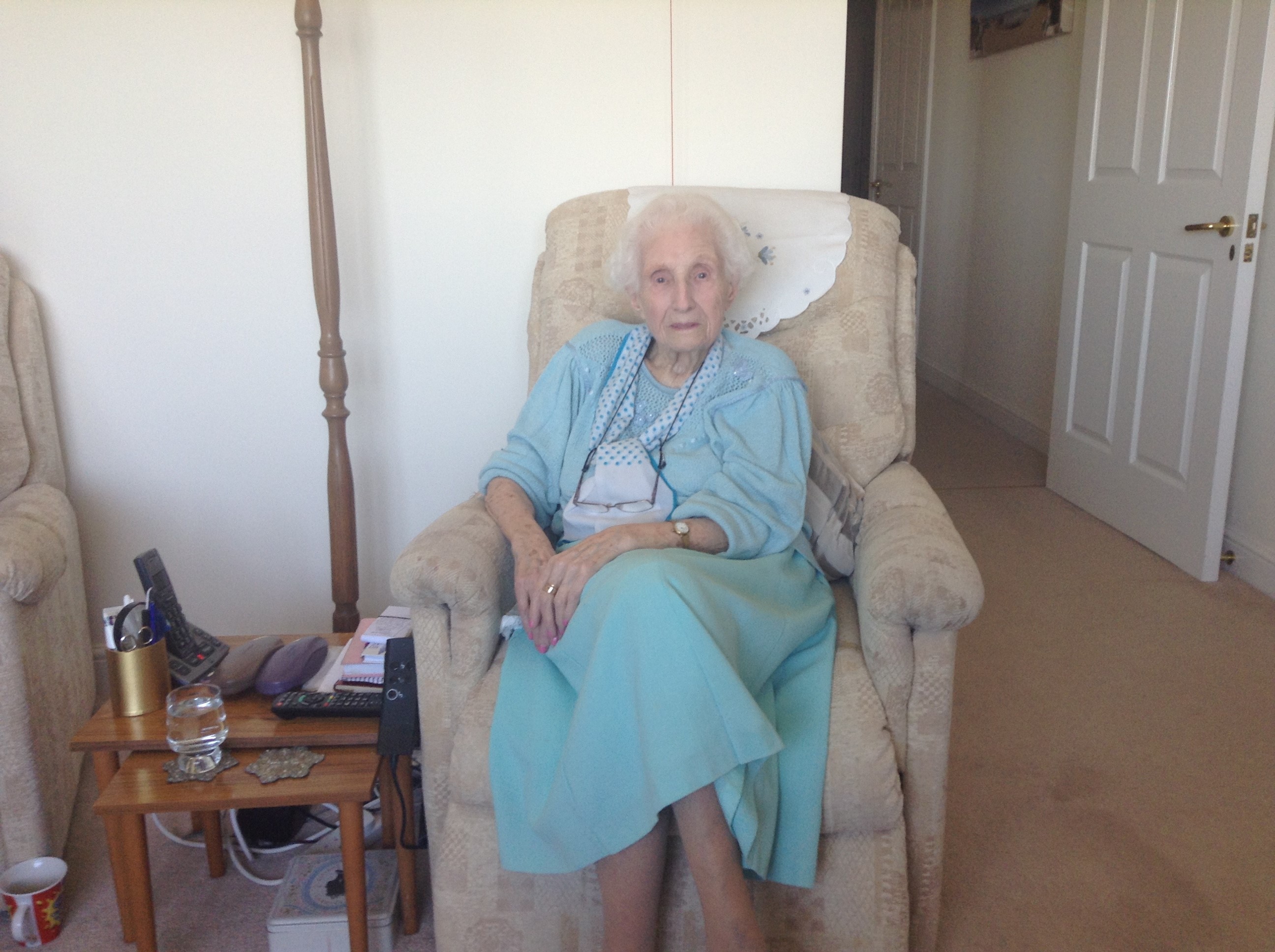Rosetta West, sitting in a chair