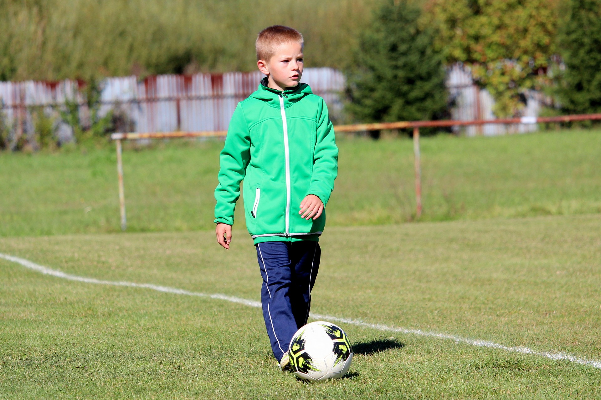 A young lad playing football