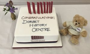 Accreditation cake with mascot Bear Regis