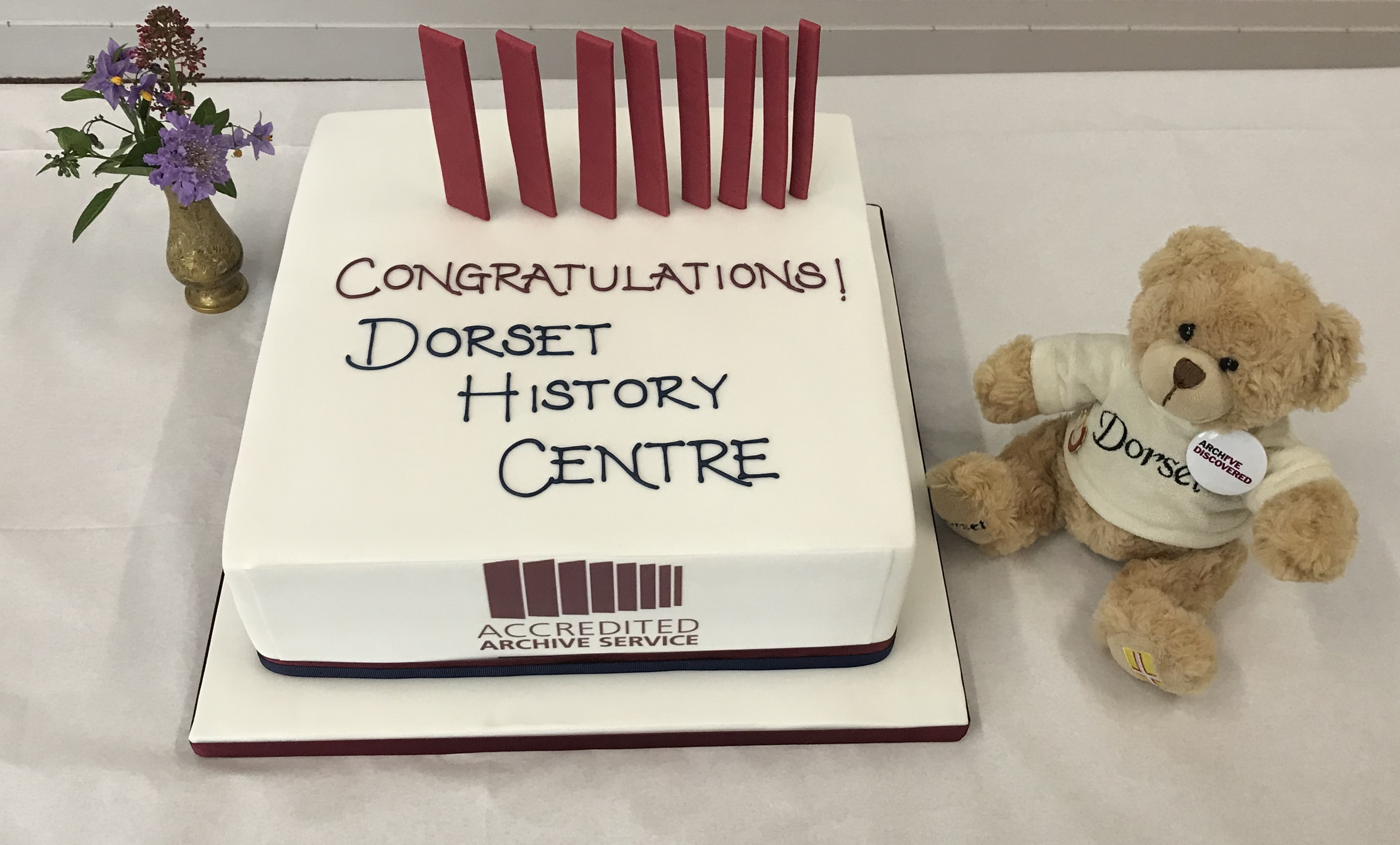 Accreditation cake with mascot Bear Regis