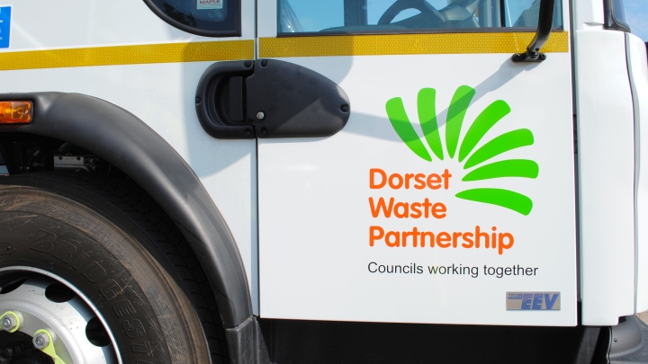 Close-up of Dorset Waste Partnership vehicle door with logo
