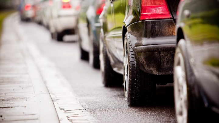 Queuing cars on a road
