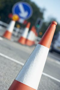 Cones and signs in road