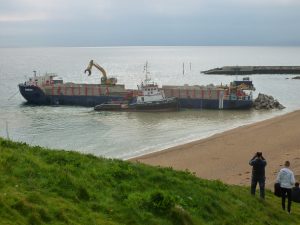 Rock ships at work in West Bay