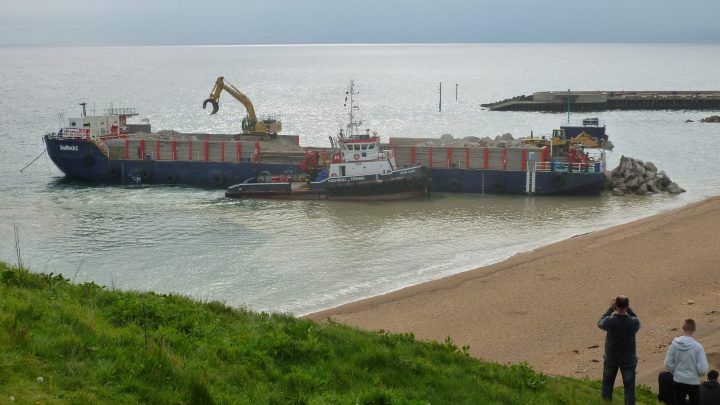 Rock ships at work in West Bay