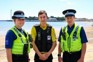 Our patrol officer Sam, centre, pictured with Police Community Support Officers Alice and Simon on the beat in Weymouth