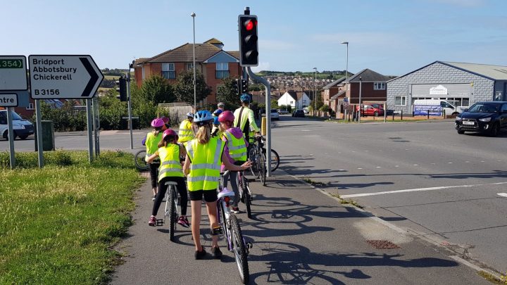 Young people on bikes, whilst taking part in their Bikeability training