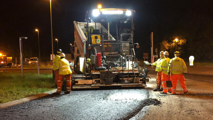 paver machine operating at night