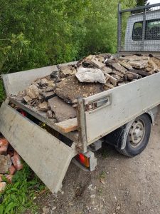 Fly-tipping contents on back of van