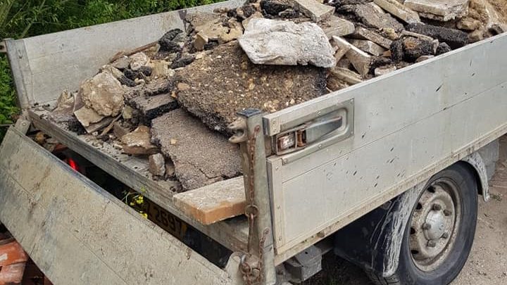 Fly-tipping contents on back of van