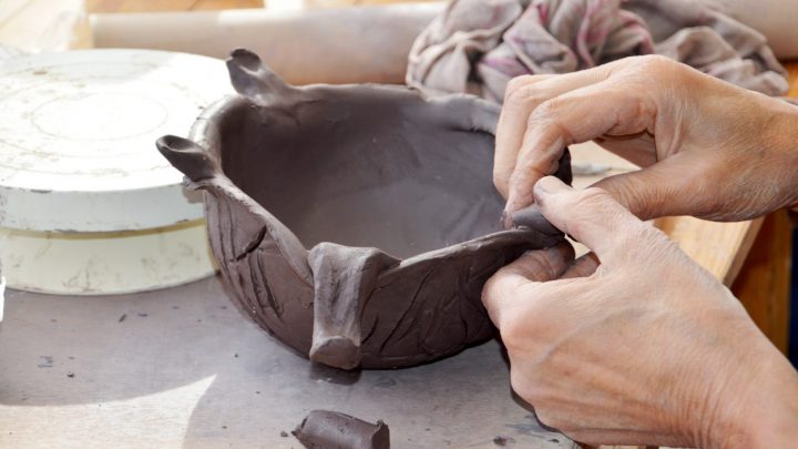 Hands working with clay