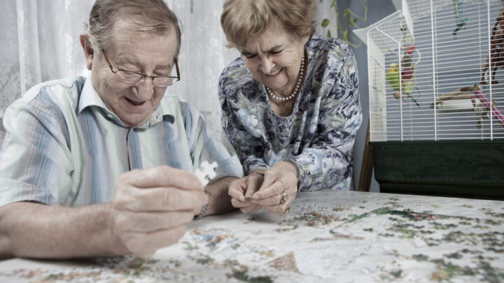 Image of elderly couple doing a puzzle