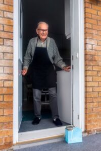 Older man in doorway