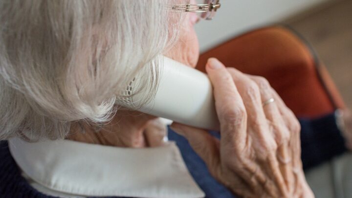 Elderly person talking on phone