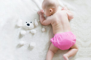 baby on changing mat