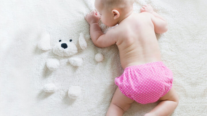 baby on changing mat