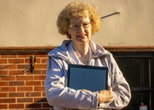 Lady holding tablet (device)