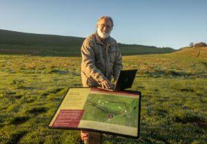 Wherever you are in Dorset a Digital Champion is waiting to help you on the other end of the Dorset Digital Hotline. Pictured: Digital Champion Mike Watson at Maiden Castle.