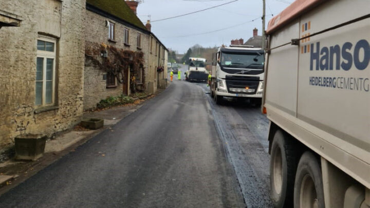 resurfacing trucks lined up on Dorset road