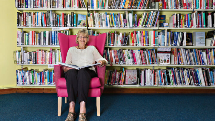 Woman sat in library