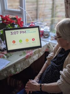 Joan, 87 and from north Dorset, with her new Ethel device, which connects her to loved ones, carers and her friends from the day centre.