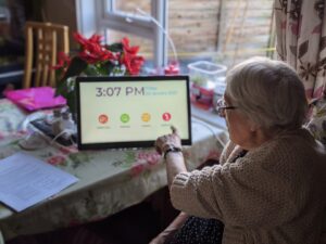 Joan, 87 and from north Dorset, with her new Ethel device, which connects her to loved ones, carers and her friends from the day centre.