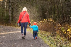 Woman walking with child