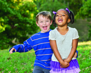 Two children smiling