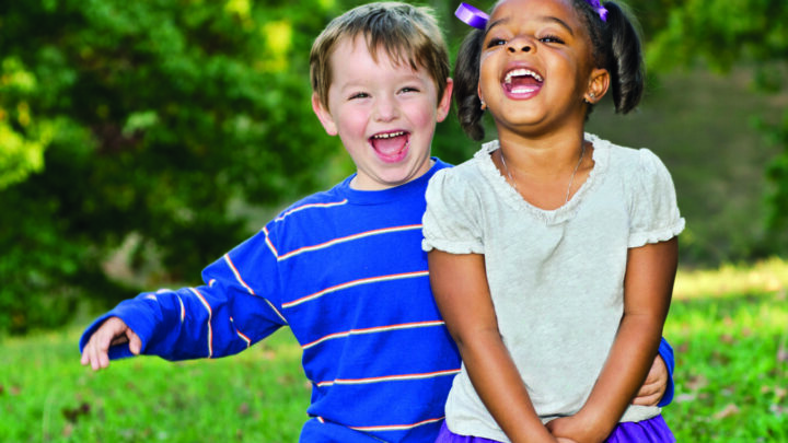 Two children smiling