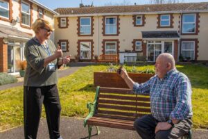 Caryn Mitchell, the Hearing Lead of Millbrook Health Care, helped John to become confident using his new smartphone.