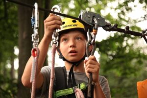 Child clipping into harness