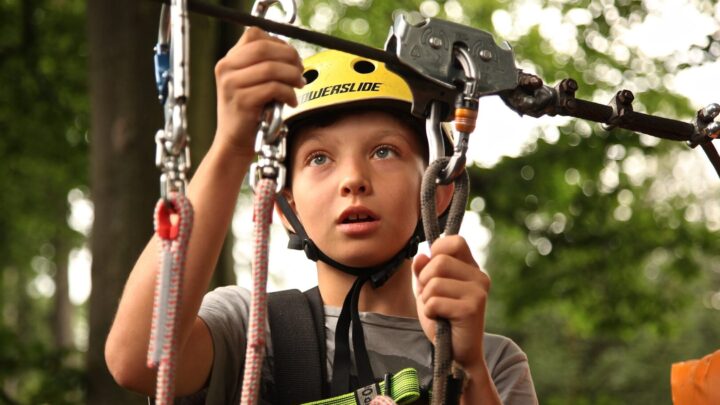 Child clipping into harness