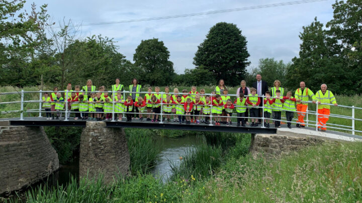 schoolchildren on the new footbridge