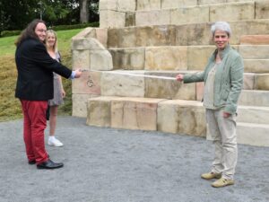 Photo of Councillor Noc Lacey-Clarke, Cabinet Lead Member for Environment, Travel and Harbours, cutting the ribbon to mark the official launch.