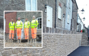 an image of the finished wall and the four workmen