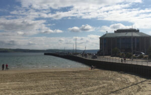 A view of Weymouth pavilion and the car park from the beach