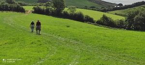two people walking in the countryside
