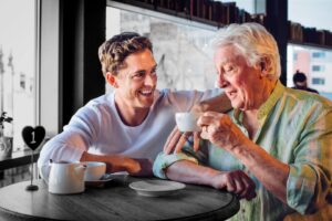 young man and older man drinking tea
