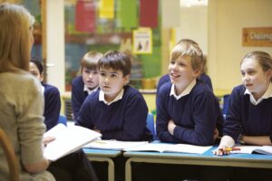 children in blue jumpers