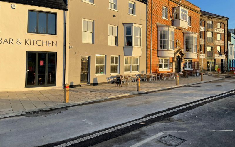 Custom House Quay with some paving complete and areas waiting to be surfaced