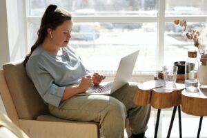 Girl with learning disability working on a laptop