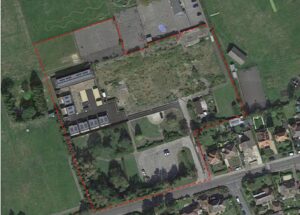 Aerial photo of former middle school site in Wareham with red dash boundary marker
