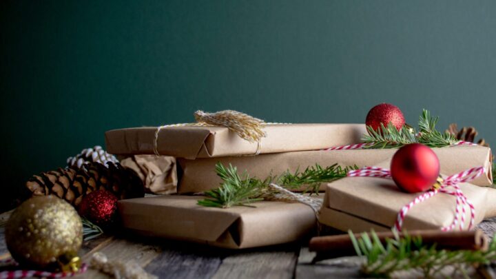 Image of presents, holly, and Christmas baubles