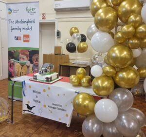 balloons banner and celebration cake