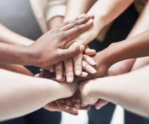 Multiple hands on top of each other